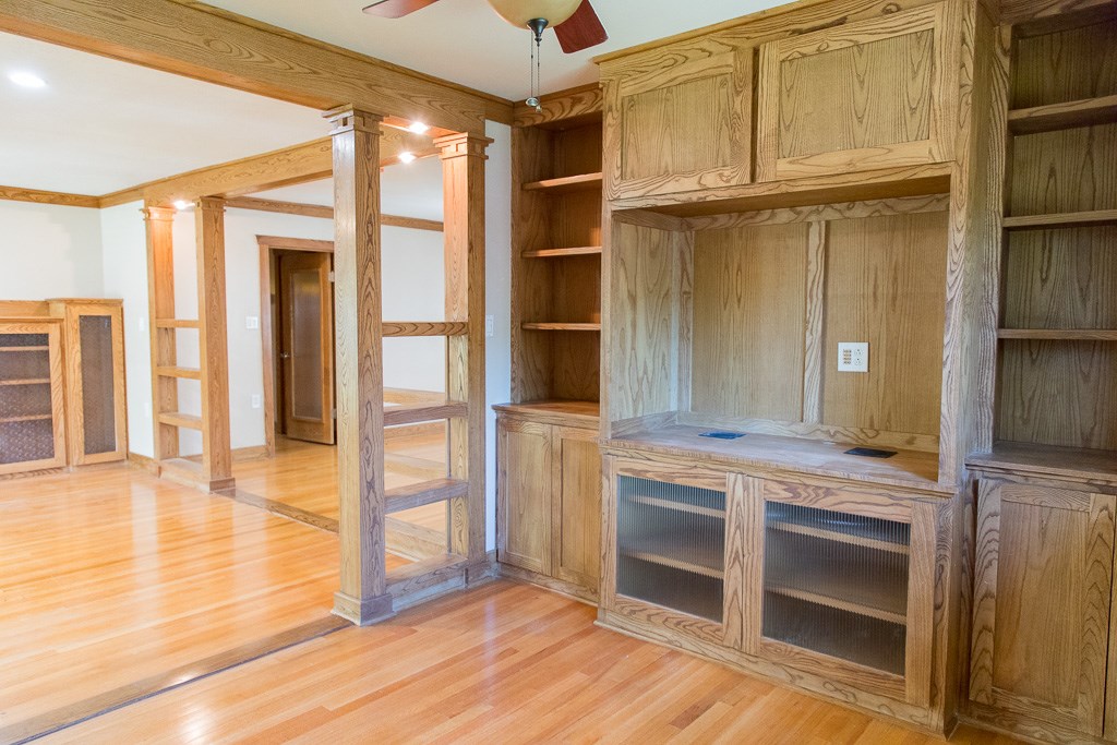 9010 Linkmeadow Lane Houston, TX 77025 - Photo 16 of 39 a view of an empty room with wooden floor and a window