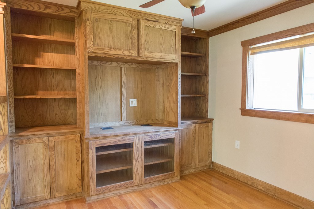 9010 Linkmeadow Lane Houston, TX 77025 - Photo 17 of 39 a view of an empty room with wooden floor and a window