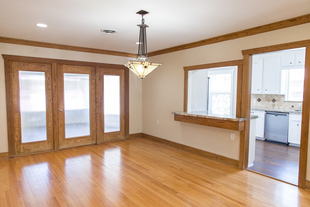 9010 Linkmeadow Lane Houston, TX 77025 - Photo 18 of 39 a view of an empty room with window and wooden floor