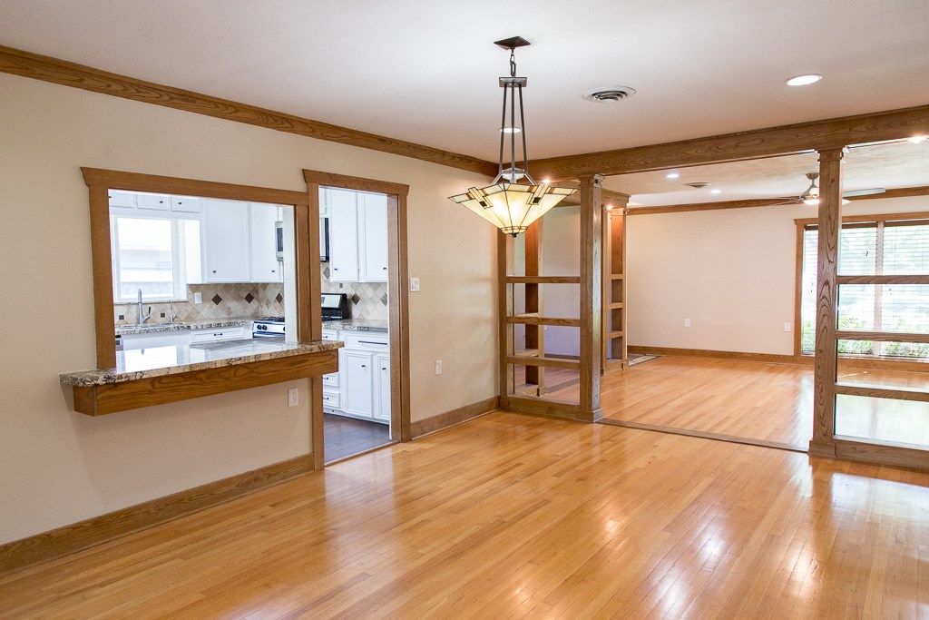 9010 Linkmeadow Lane Houston, TX 77025 - Photo 20 of 39 a view of a room with a window and wooden floor