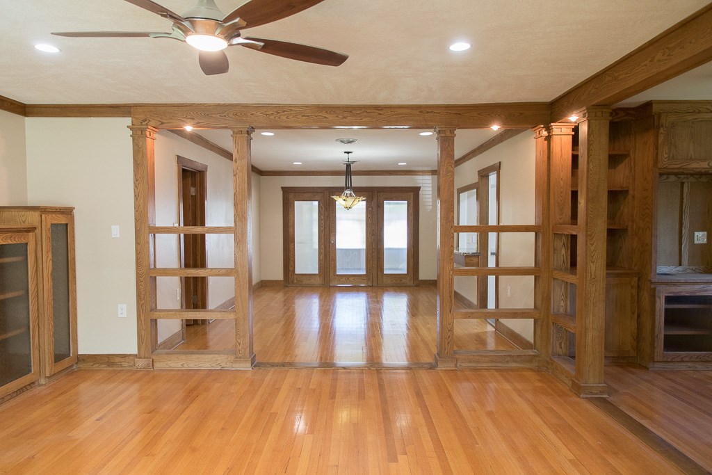 9010 Linkmeadow Lane Houston, TX 77025 - Photo 2 of 39 a view of empty room with wooden floor and fan