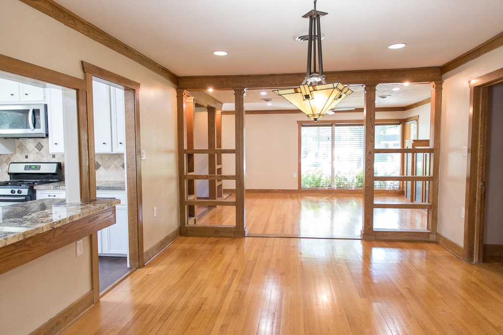 9010 Linkmeadow Lane Houston, TX 77025 - Photo 21 of 39 a view of a kitchen with wooden floor and a window