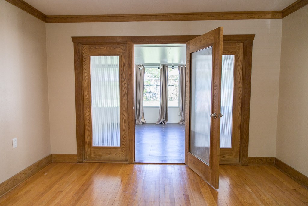 9010 Linkmeadow Lane Houston, TX 77025 - Photo 22 of 39 a view of a hallway with wooden floor