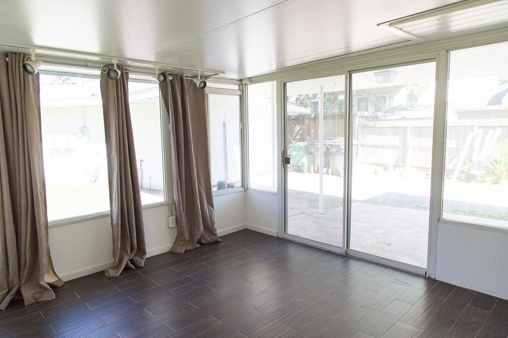 9010 Linkmeadow Lane Houston, TX 77025 - Photo 23 of 39 a view of an empty room and wooden floor