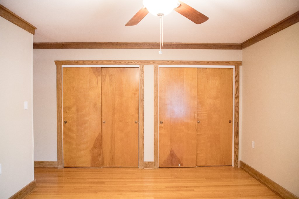 9010 Linkmeadow Lane Houston, TX 77025 - Photo 27 of 39 an empty room with wooden floor and windows