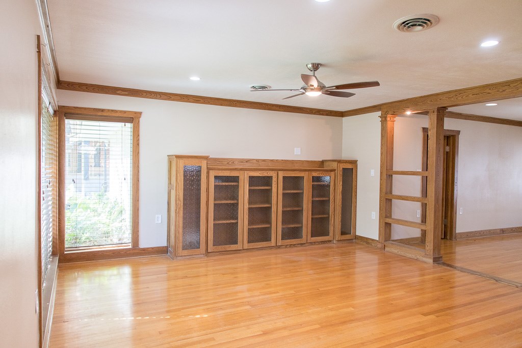 9010 Linkmeadow Lane Houston, TX 77025 - Photo 3 of 39 an empty room with wooden floor and windows