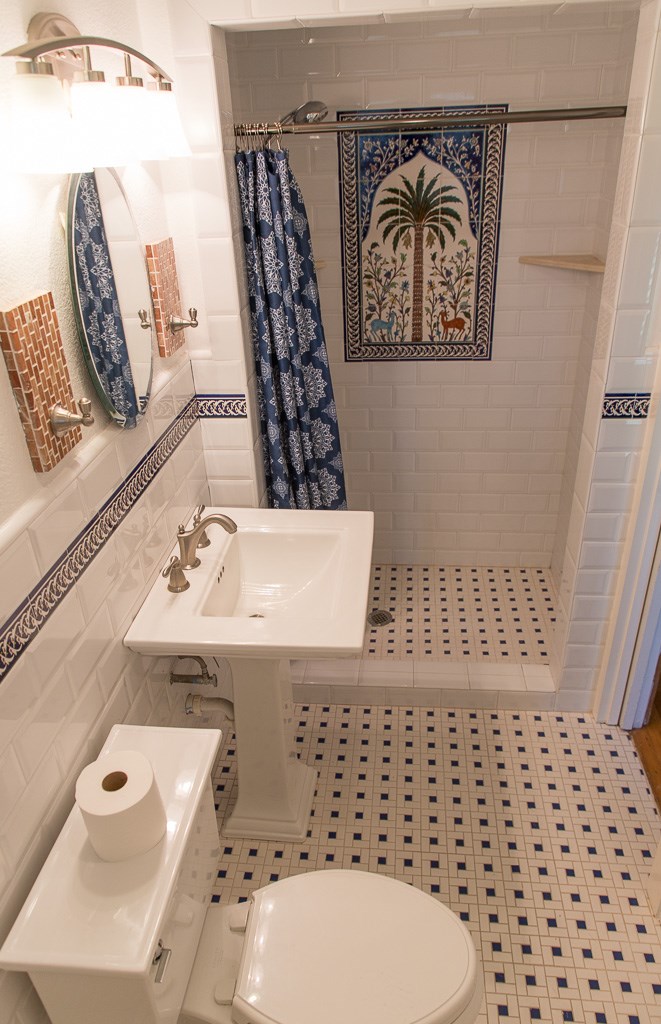 9010 Linkmeadow Lane Houston, TX 77025 - Photo 31 of 39 a bathroom with a sink a toilet and a shower curtain