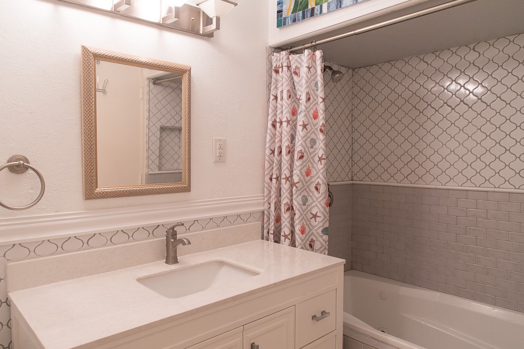 9010 Linkmeadow Lane Houston, TX 77025 - Photo 33 of 39 a bathroom with a sink and a mirror