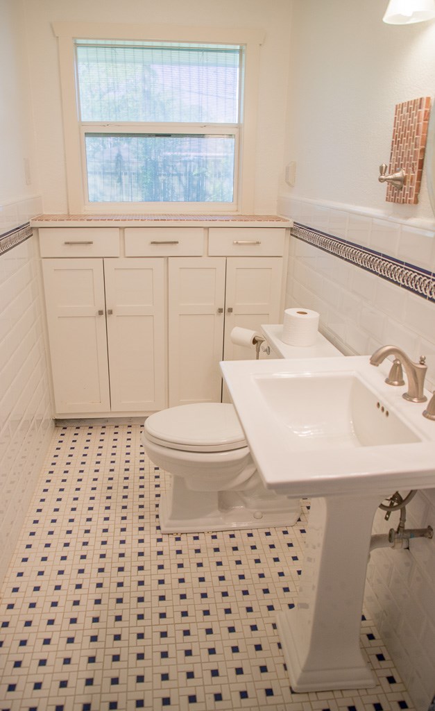9010 Linkmeadow Lane Houston, TX 77025 - Photo 34 of 39 a bathroom with a sink a toilet and window