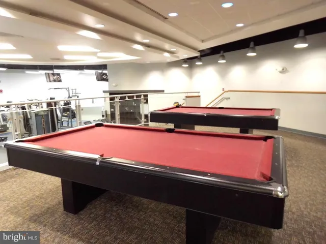 a view of a park with bench and trees