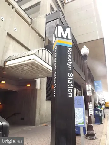 a view of a shop with a street