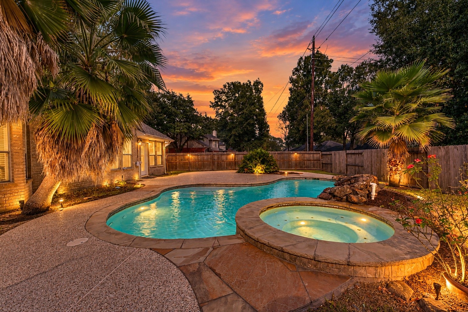 6338 Maple Spring Place Humble, TX 77346 - Photo 3 of 50 Virtually rendered (new pool lights do exist). Your own backyard oasis! Enjoy relaxing evenings by the sparkling pool, complete with a rock waterfall, spa, and expansive patio perfect for entertaining under the stars.