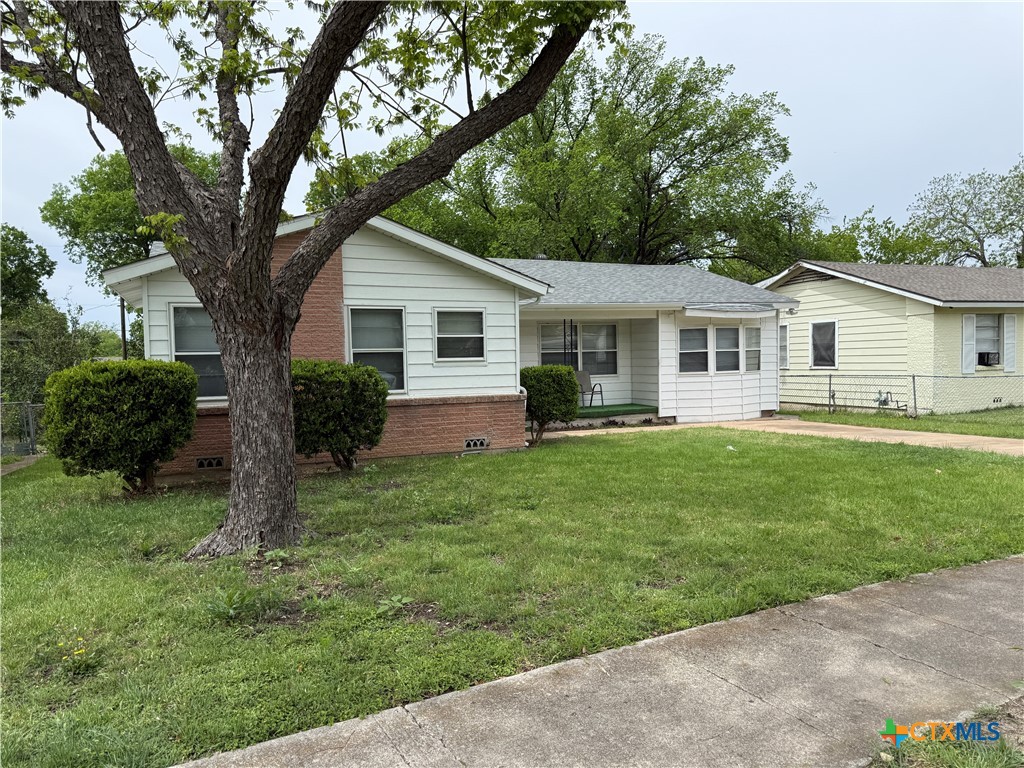 411 Cardinal Avenue Killeen, TX 76541 - Photo 1 of 14 a front view of house with yard and green space