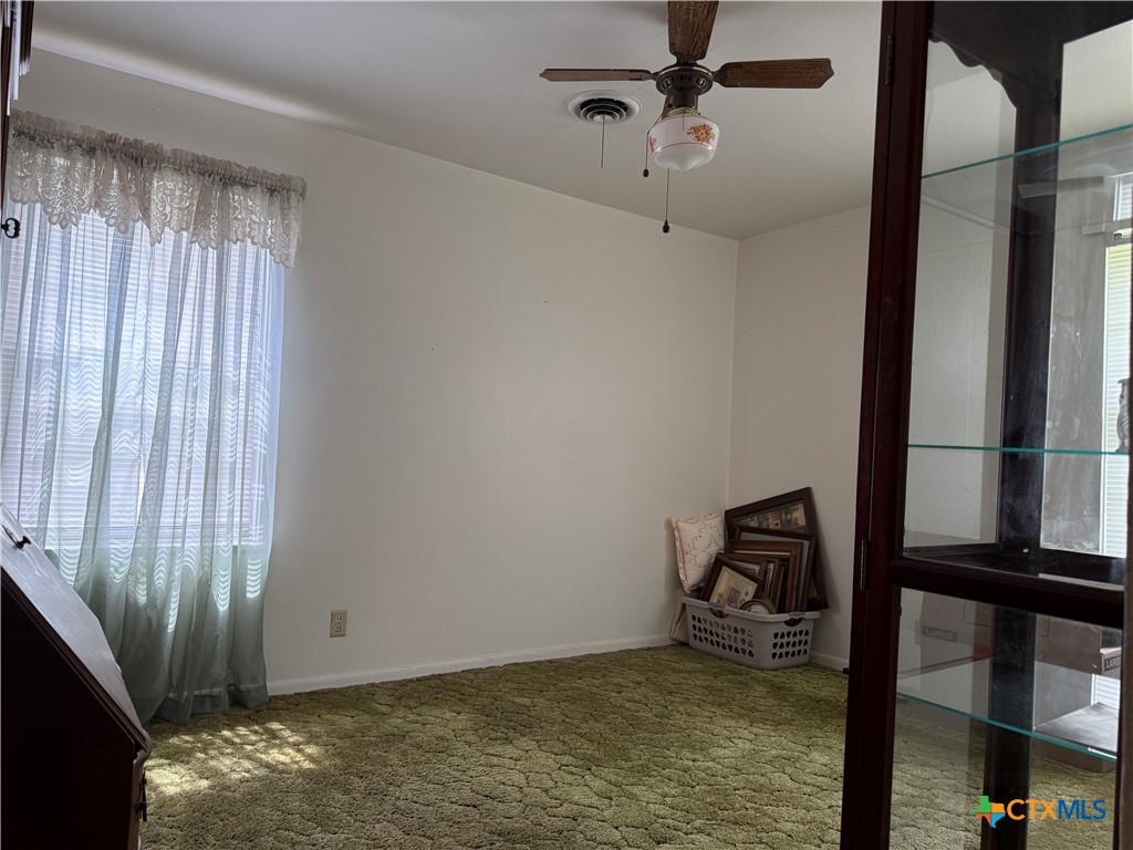 411 Cardinal Avenue Killeen, TX 76541 - Photo 11 of 14 a view of room with window and hardwood floor