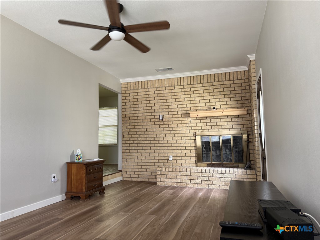 411 Cardinal Avenue Killeen, TX 76541 - Photo 7 of 14 a view of livingroom with furniture wooden floor and window