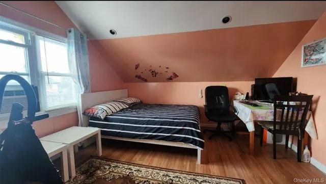 a view of workspace with wooden floor windows