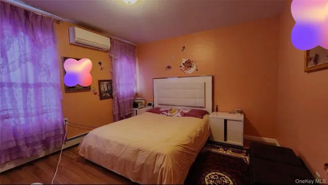 a bed room with a bed and a night stand