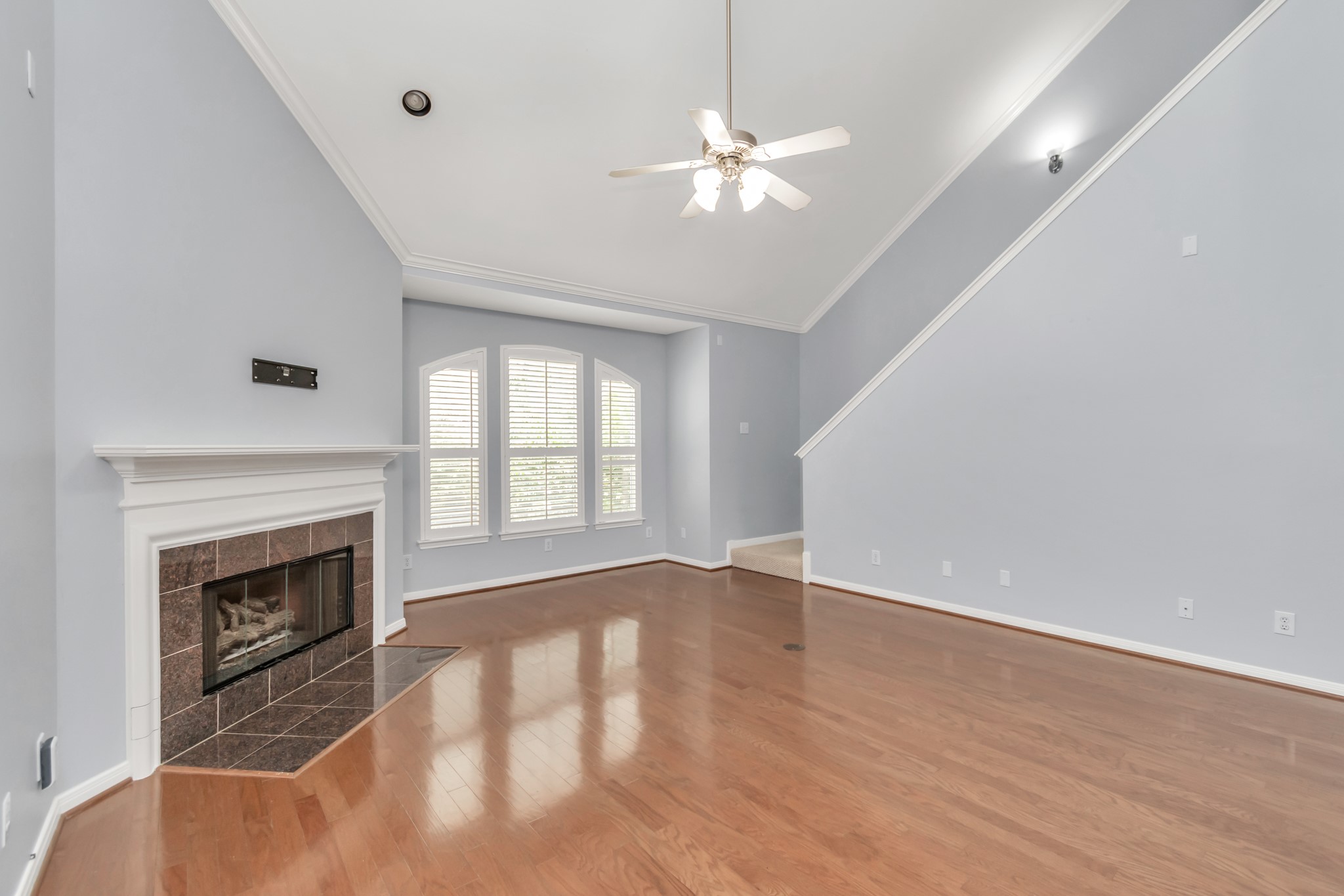 2901 West Dallas Street Houston, TX 77019 - Photo 11 of 39 wooden floor fireplace and windows in an empty room
