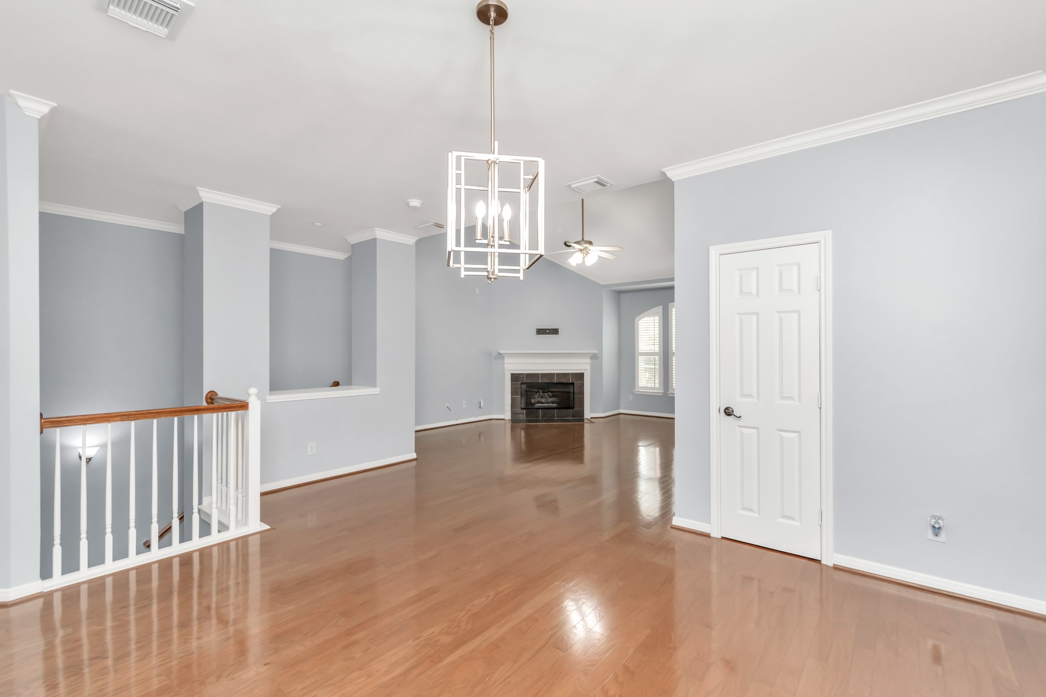 2901 West Dallas Street Houston, TX 77019 - Photo 15 of 39 a view of a livingroom with a fireplace wooden floor and chandelier