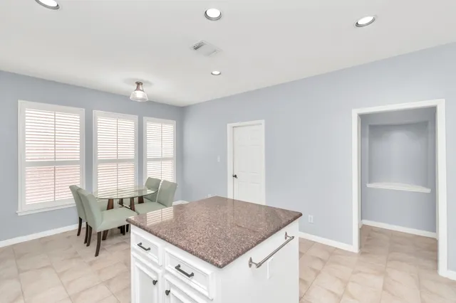 a dining room with a window and a table