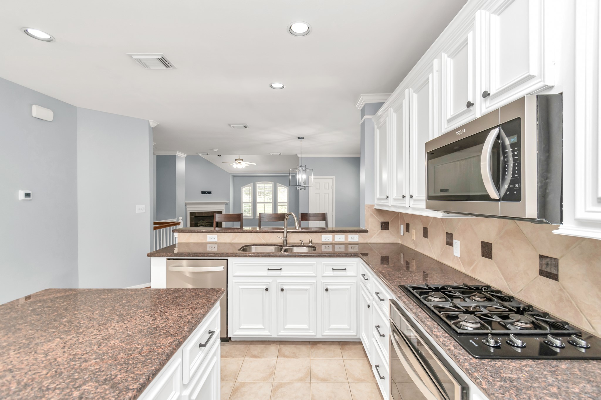 2901 West Dallas Street Houston, TX 77019 - Photo 23 of 39 a kitchen with stainless steel appliances granite countertop a stove and a sink