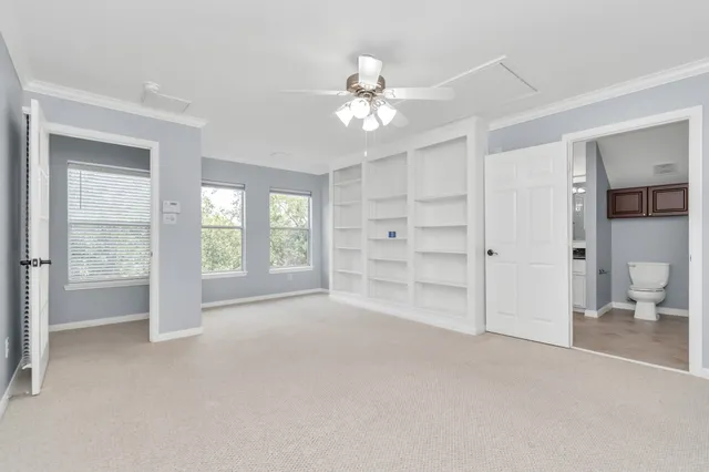 a view of empty room with a fireplace