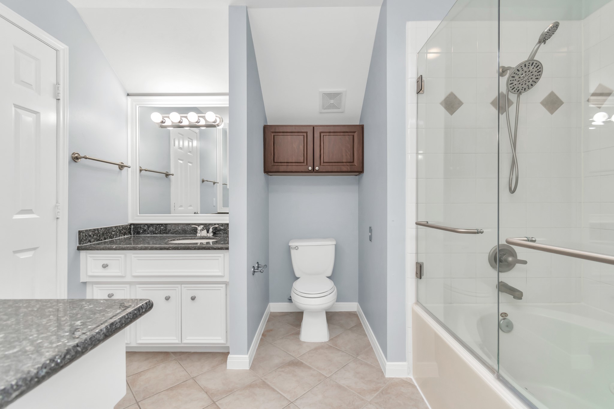 2901 West Dallas Street Houston, TX 77019 - Photo 31 of 39 a bathroom with a granite countertop sink a toilet and shower