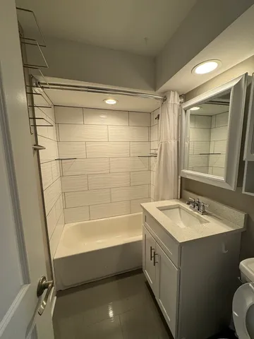 a bathroom with a bathtub and a sink