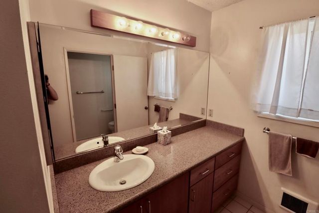 a view of a bathroom from the hallway