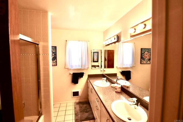 a bathroom with a sink a mirror and a bathtub