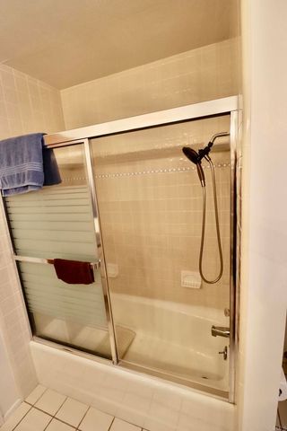 a workspace with chandelier fan and a window