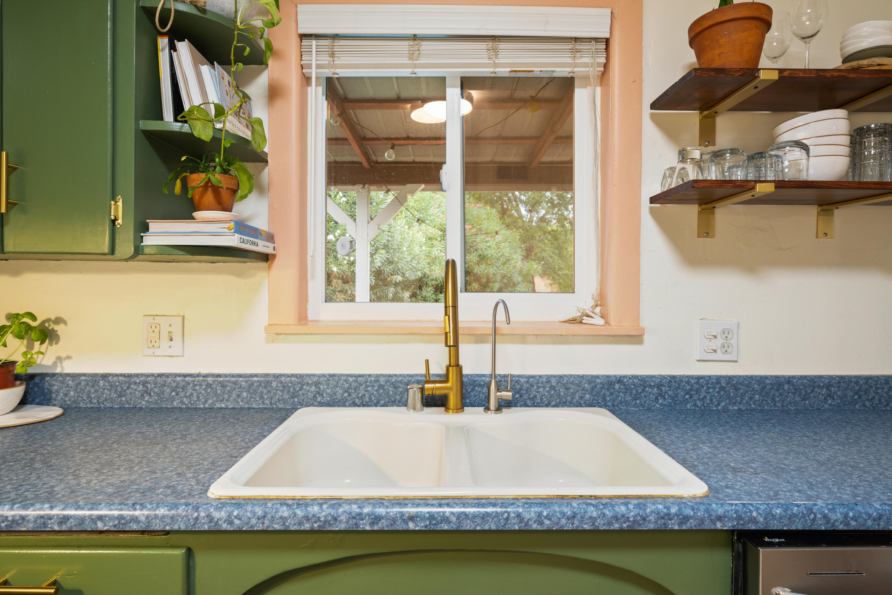 2056 Canal Drive Redding, CA 96001 - Photo 11 of 46 a bathroom with a granite countertop sink and a bathtub