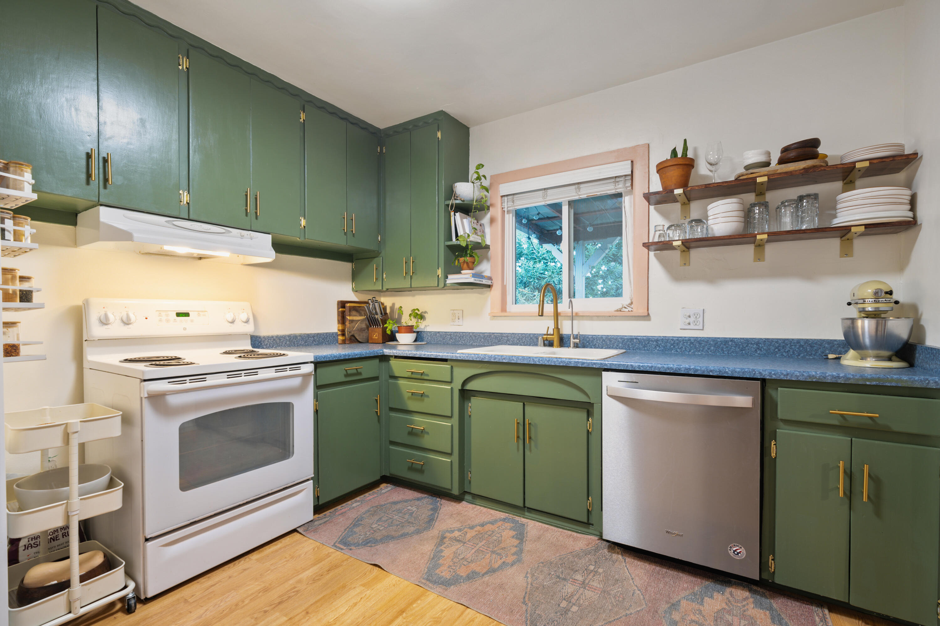 2056 Canal Drive Redding, CA 96001 - Photo 13 of 46 a kitchen with cabinets a sink and appliances