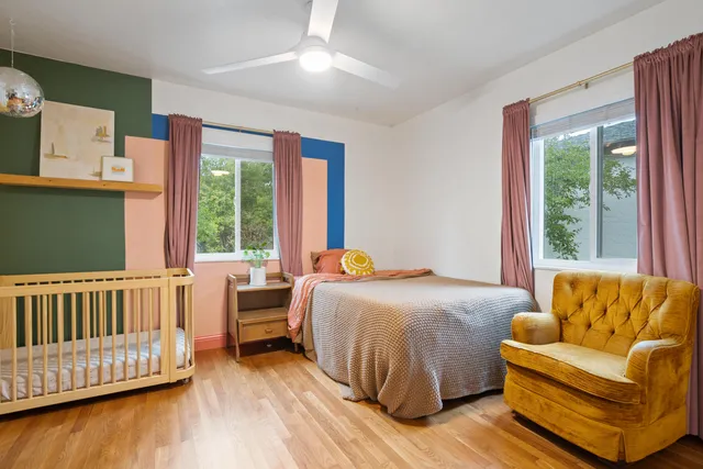 a bedroom with a bed and a couch