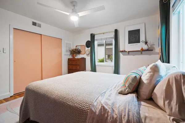 a bedroom with a bed and a dresser