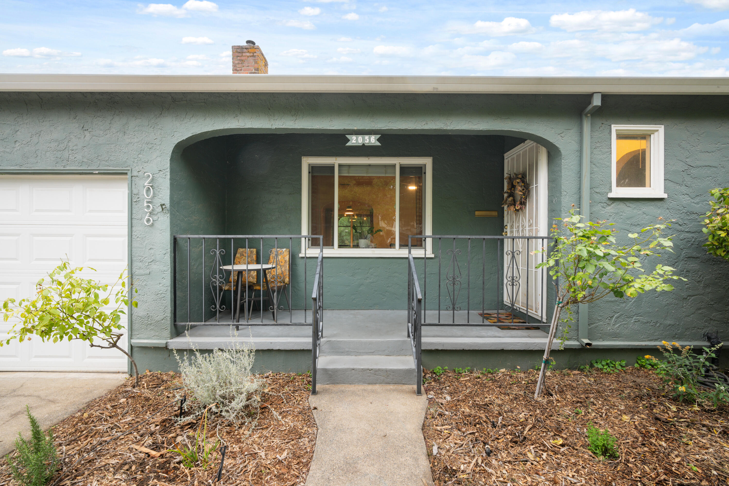 2056 Canal Drive Redding, CA 96001 - Photo 2 of 46 a front view of a house with garden