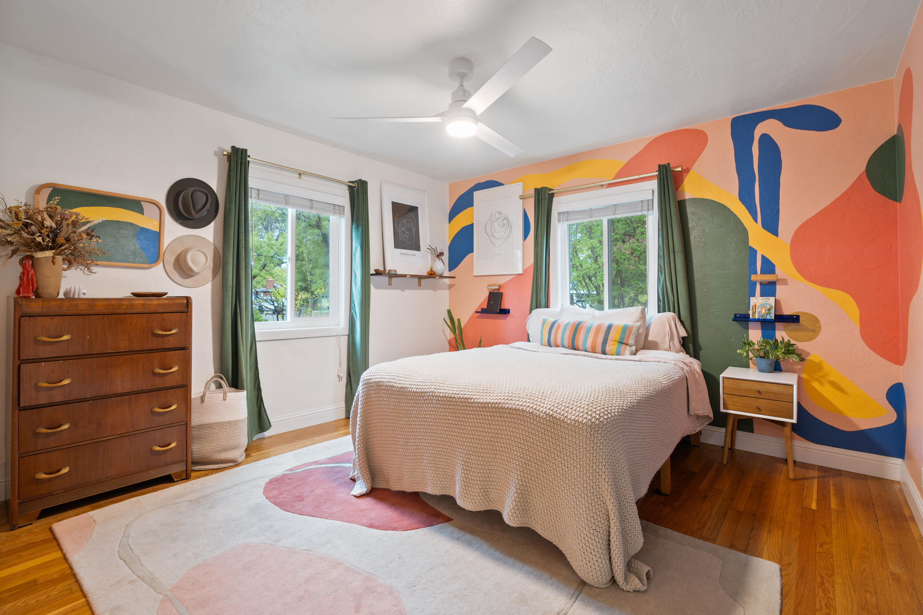 2056 Canal Drive Redding, CA 96001 - Photo 21 of 46 a bedroom with a bed and wooden floor