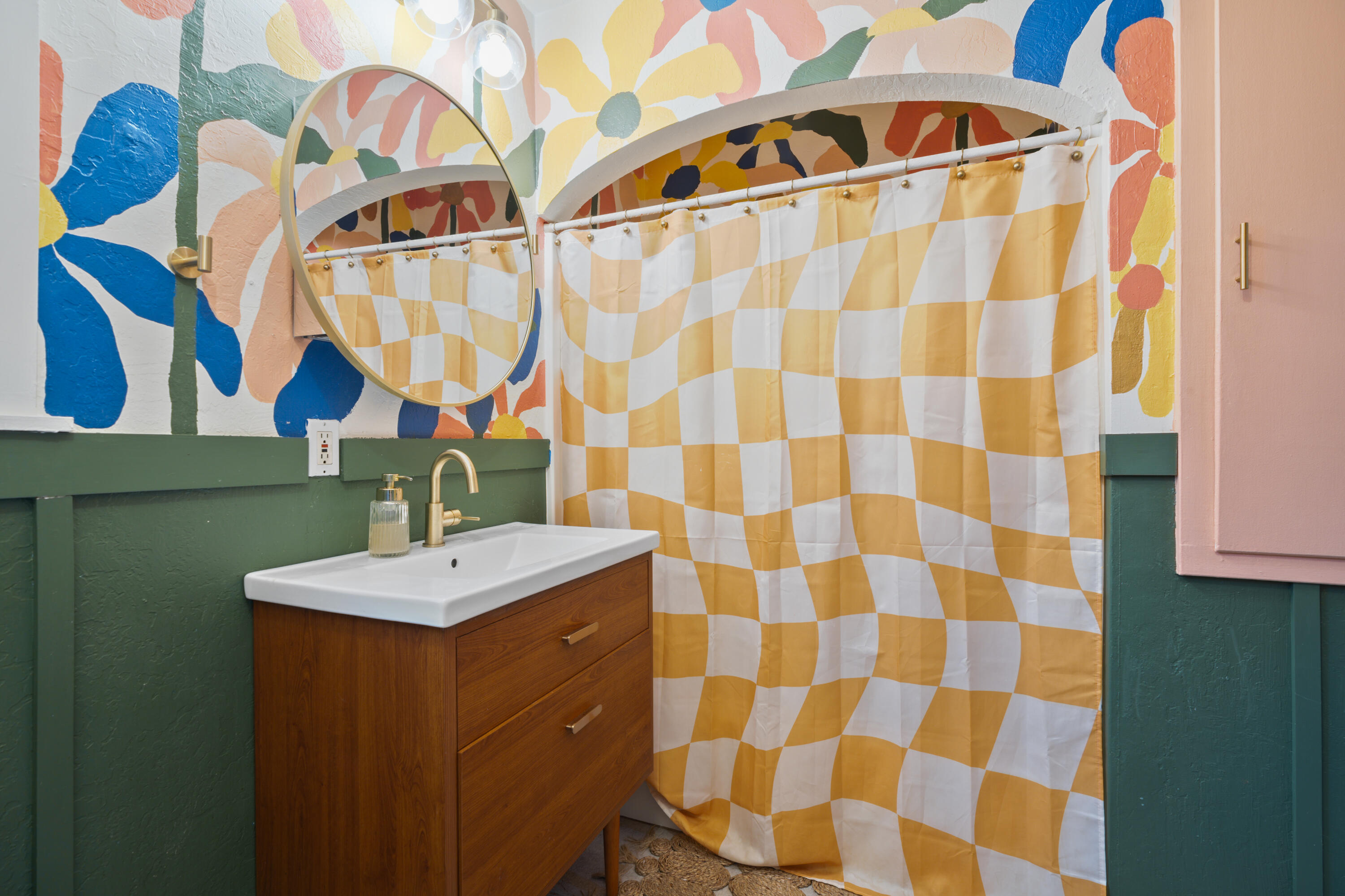 2056 Canal Drive Redding, CA 96001 - Photo 22 of 46 a bathroom with a sink a mirror and a shower curtain