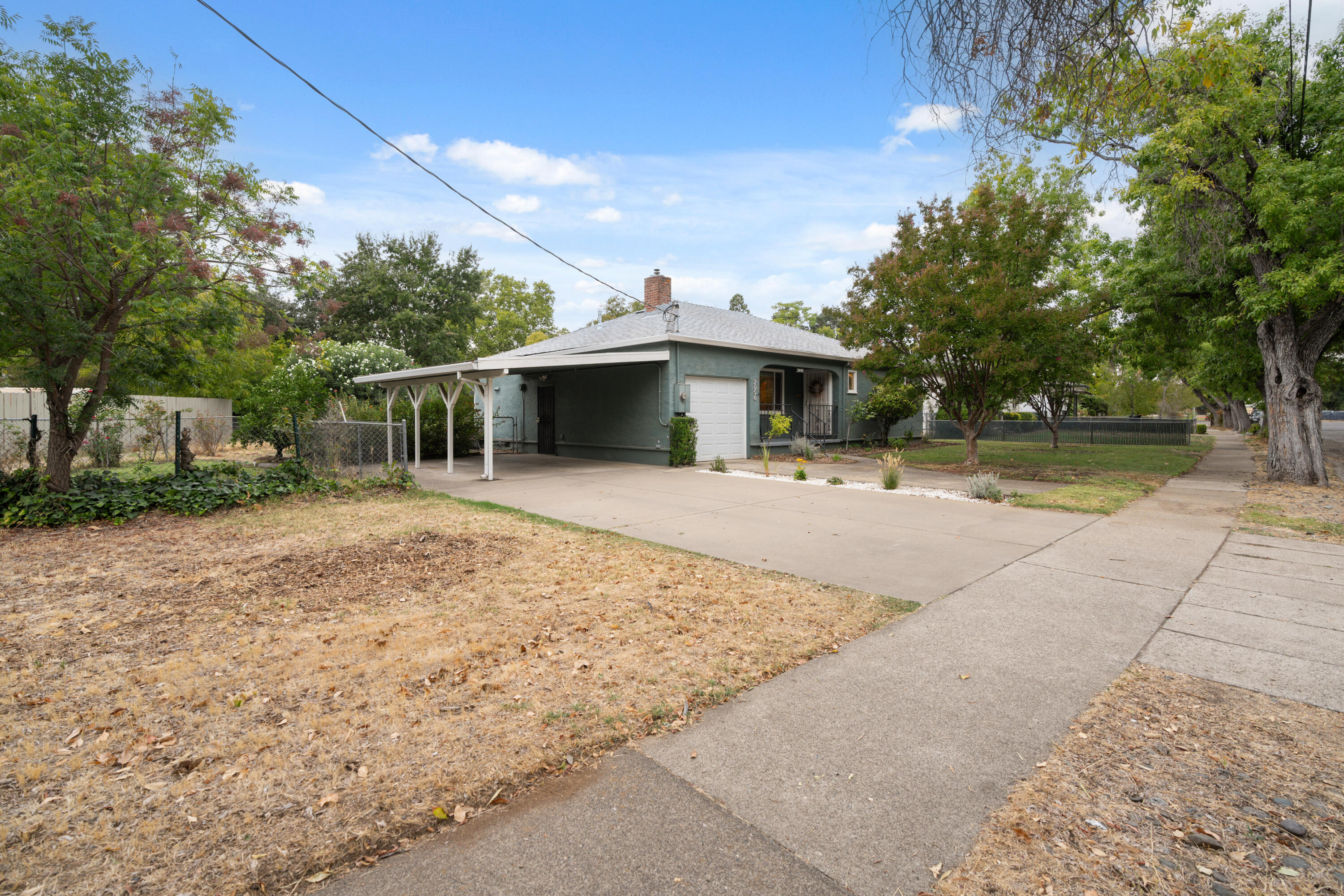 2056 Canal Drive Redding, CA 96001 - Photo 28 of 46 a view of a outdoor space with a patio and fire pit