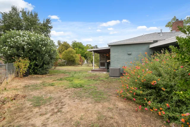 a backyard of a house with lots of green space