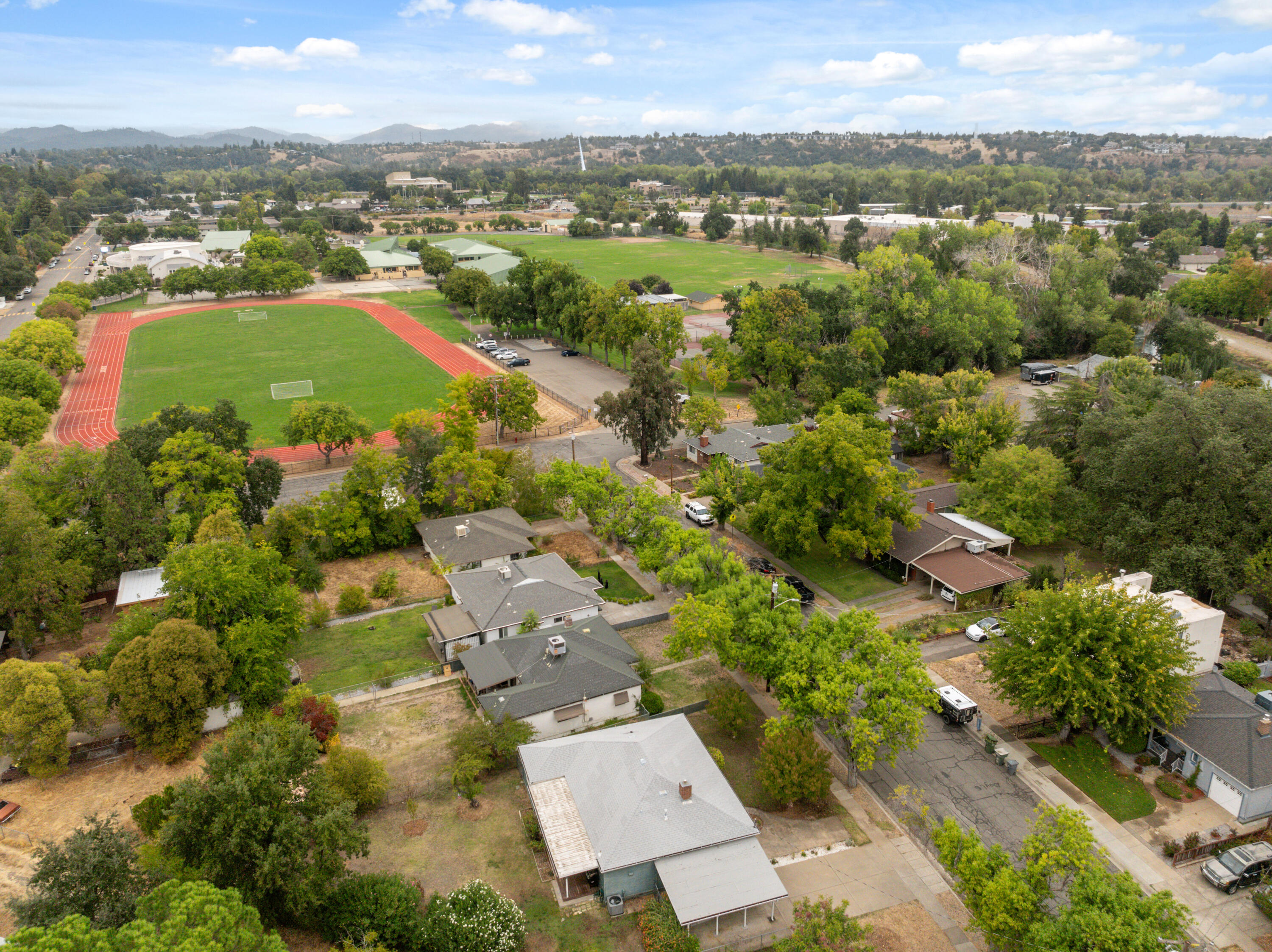 2056 Canal Drive Redding, CA 96001 - Photo 38 of 46 an aerial view of residential houses with outdoor space and trees