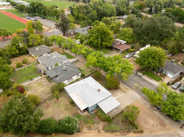 an aerial view of residential house with outdoor space