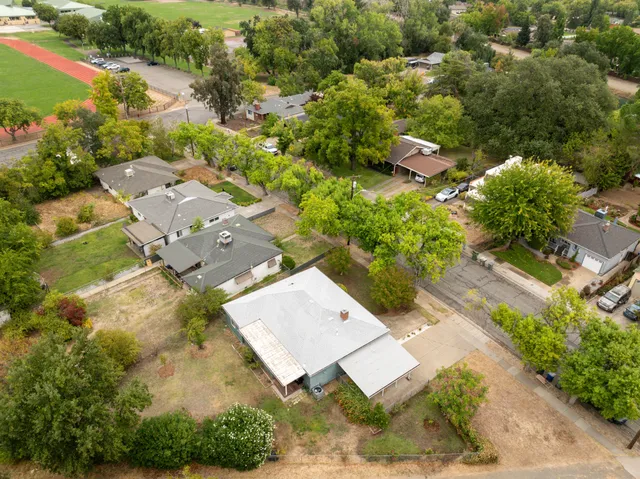 an aerial view of residential house with outdoor space