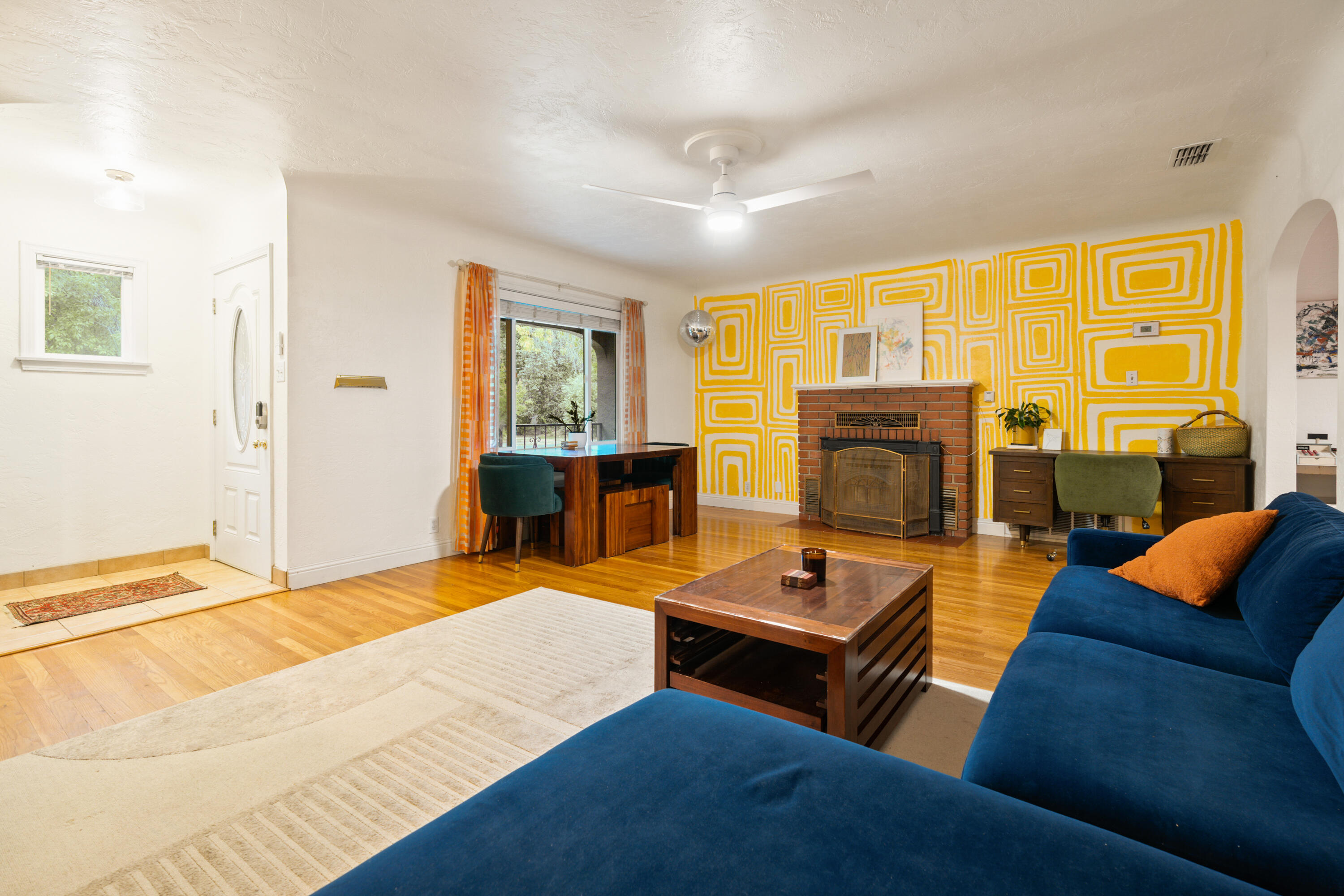 2056 Canal Drive Redding, CA 96001 - Photo 4 of 46 a living room with furniture fireplace and a table