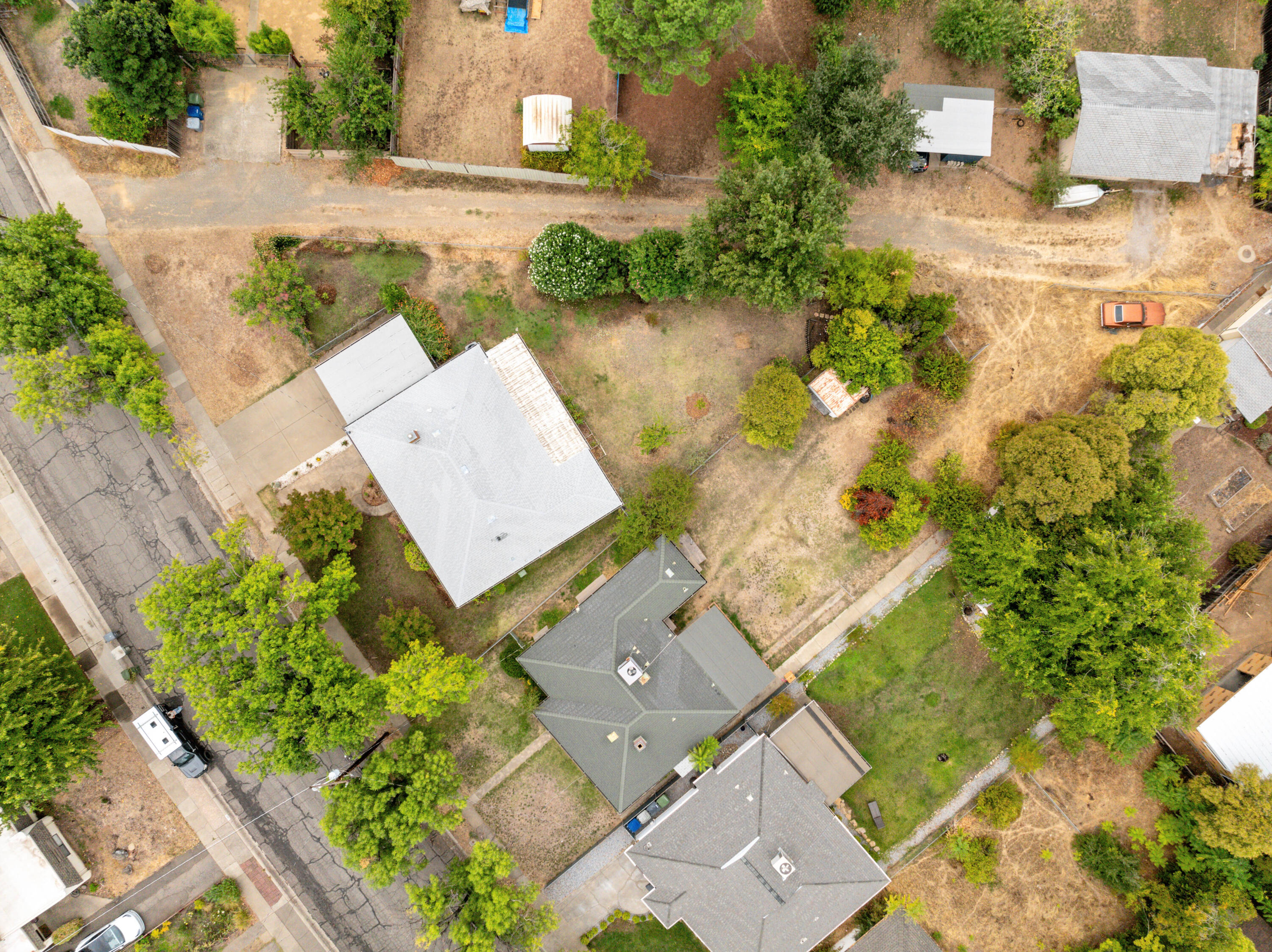2056 Canal Drive Redding, CA 96001 - Photo 44 of 46 an aerial view of a house with garden space and a lake view