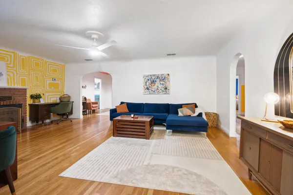 a living room with furniture and a fireplace