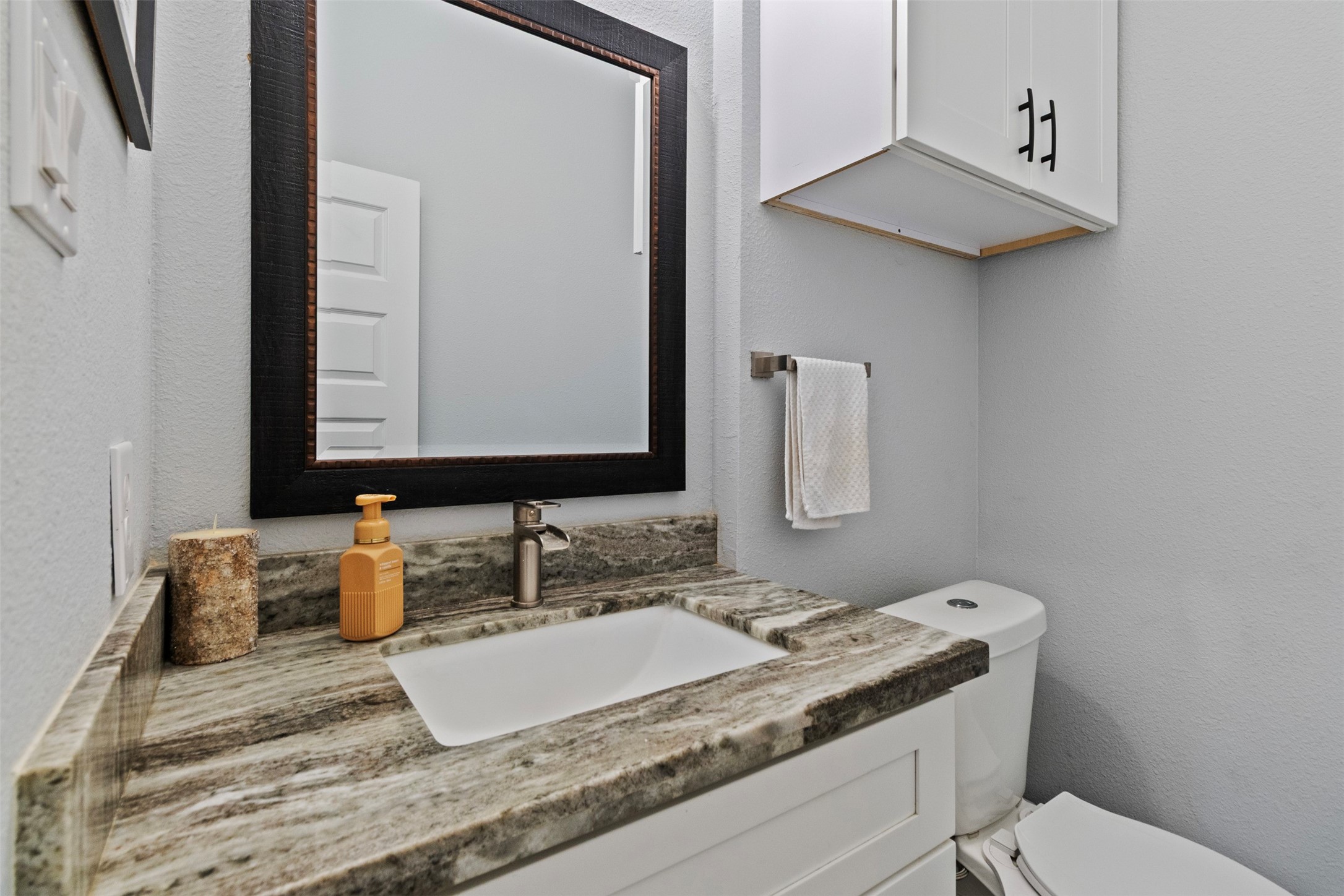 6706 Lozier Street Houston, TX 77021 - Photo 14 of 32 a bathroom with a granite countertop sink and a mirror
