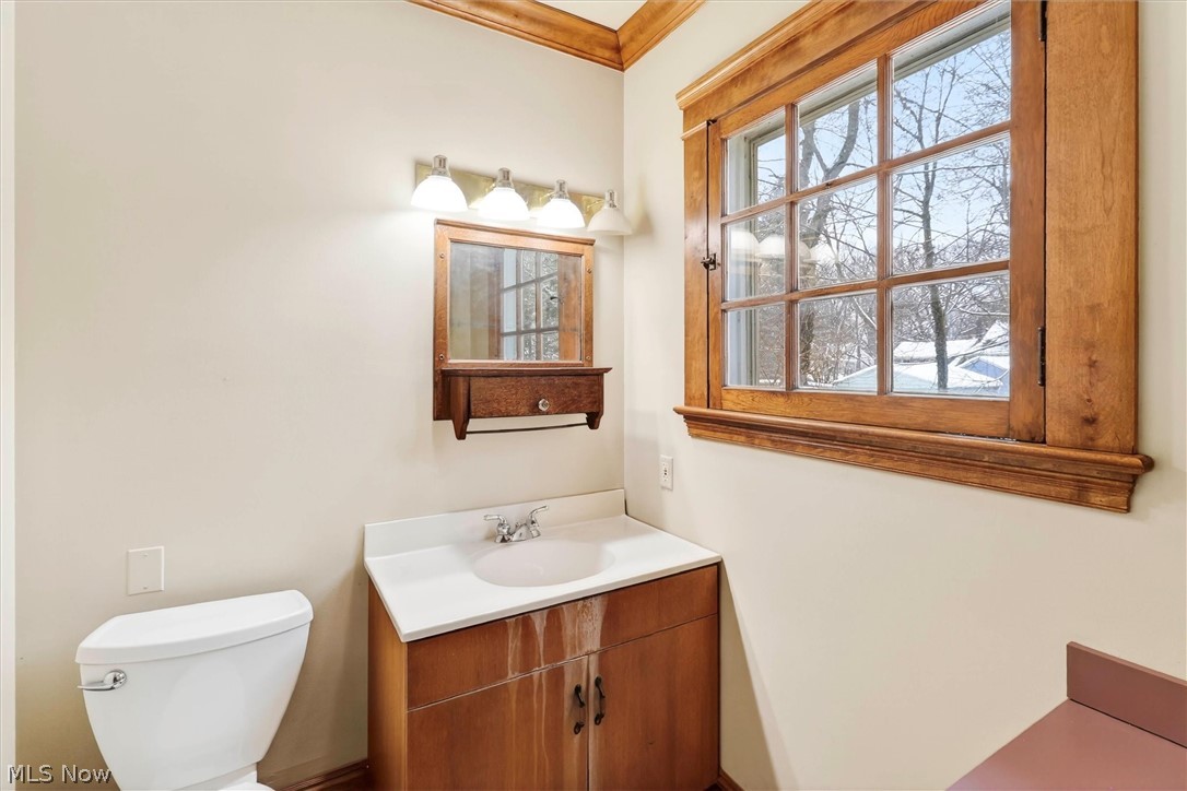 1798 Middlehurst Road Cleveland, OH 44118 - Photo 17 of 49 Half bath featuring vanity and ornamental molding
