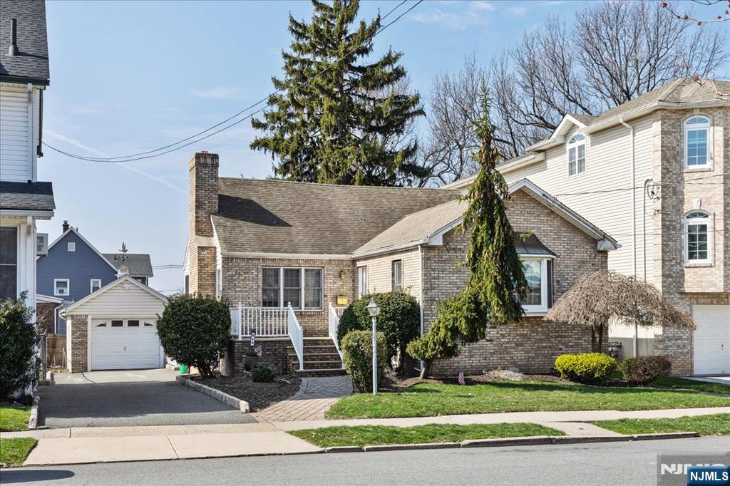 618 3rd Avenue Lyndhurst, NJ 07071 - Photo 1 of 33 a front view of a house with garden