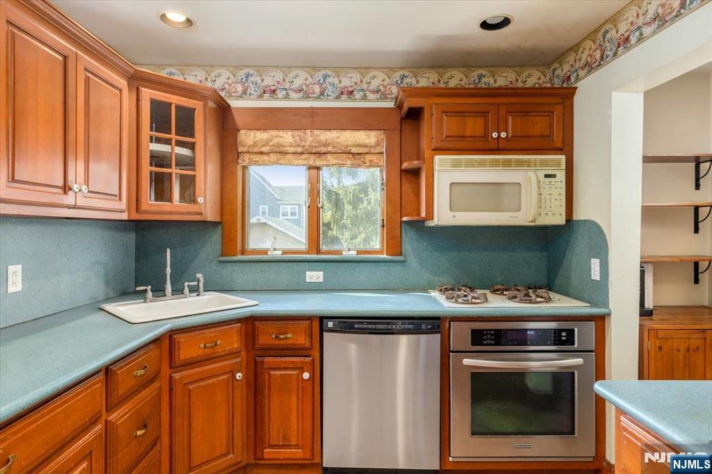 618 3rd Avenue Lyndhurst, NJ 07071 - Photo 11 of 33 a kitchen with stainless steel appliances granite countertop a stove a sink and a microwave
